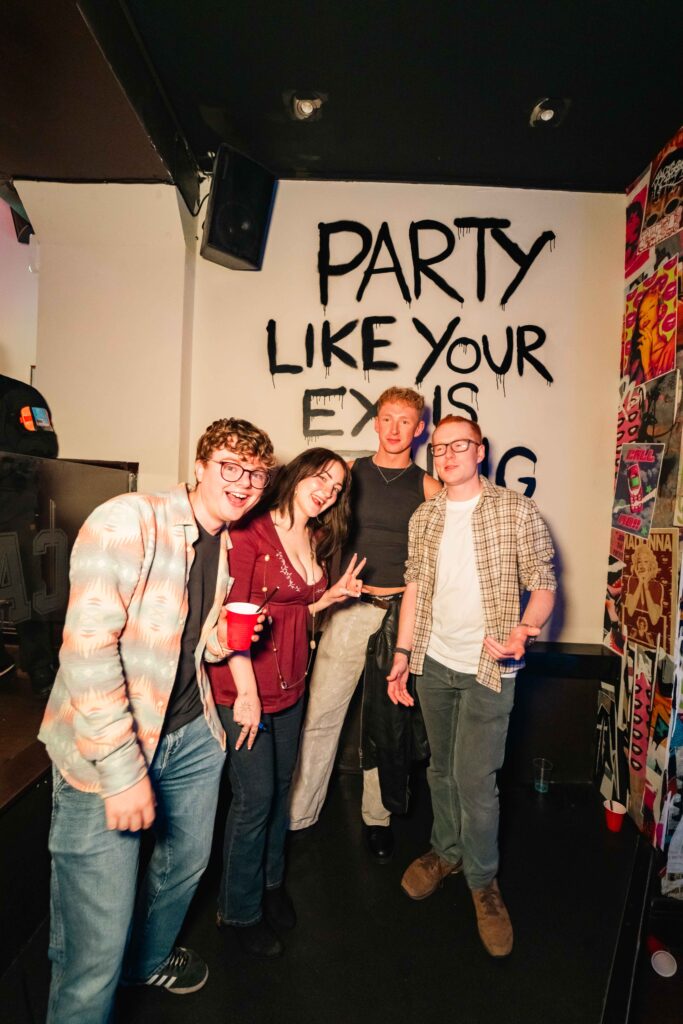 Guests posing at a Campus Liverpool party
